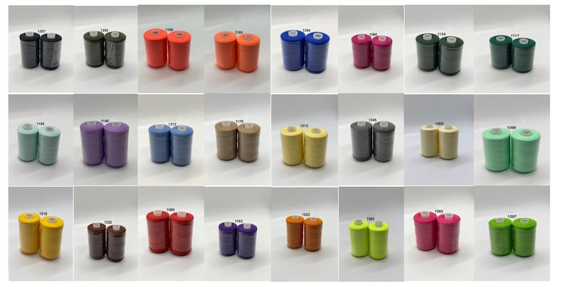 May include: A collection of 20 spools of thread in various colors, including black, green, orange, blue, red, beige, yellow, brown, purple, and light green. Each spool is labeled with a number.