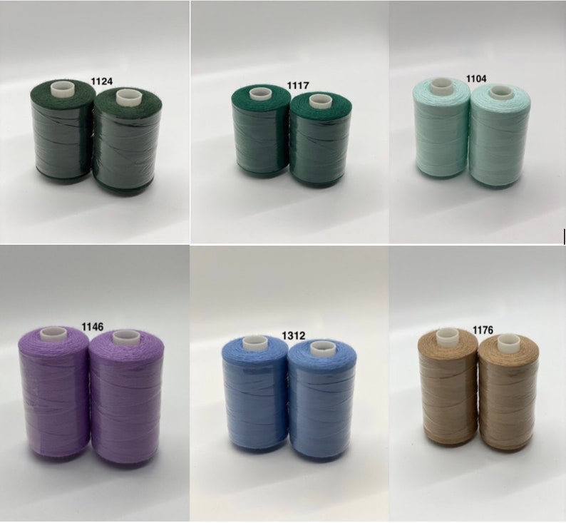 May include: Six spools of thread in different colors. The spools are labeled with numbers: 1124, 1117, 1104, 1146, 1312, and 1176.