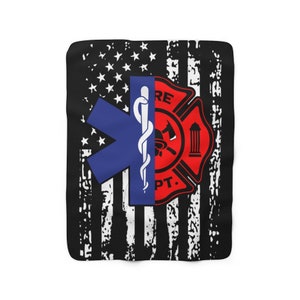 May include: A black and white distressed American flag design with a red and blue medical symbol and a red and black firefighter symbol in the center. The medical symbol is a blue star of life with a snake and staff. The firefighter symbol is a red circle with an axe, a fire hose, and a building.