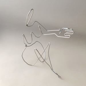 minimalist wire art feminine figure