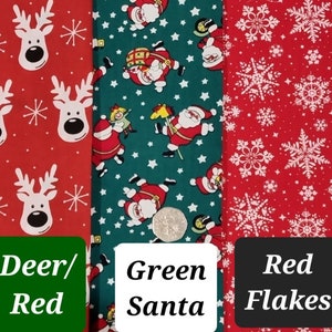 May include: Four different fabric swatches with Christmas themes. The first two swatches feature a white reindeer on a green and red background. The third swatch features a green background with white stars and Santa Claus figures. The fourth swatch features a red background with white snowflakes. The last swatch features a green background with a variety of colorful emoji faces.