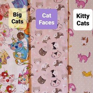 May include: Three fabric swatches with different cat designs. The first swatch features large, colorful cats with floral accents. The second swatch has pink and white cat faces. The third swatch has small, colorful cats on a light beige background. The text on the swatches reads "Big Cats", "Cat Faces", and "Kitty Cats".