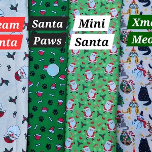 May include: Four different fabric swatches with Christmas-themed patterns. The first swatch is cream with a Santa Claus pattern. The second swatch is green with a Santa Paws pattern. The third swatch is green with a Mini Santa pattern. The fourth swatch is cream with a Christmas Meow pattern.