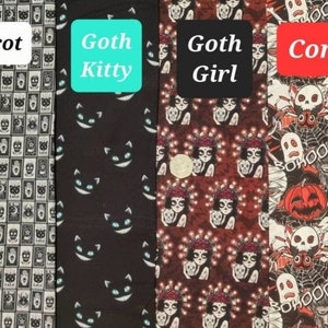May include: Four fabric swatches featuring Halloween-themed patterns. The first swatch displays a black and white pattern of tarot cards. The second swatch has a black background with a repeating pattern of white cats with blue eyes. The third swatch features a red background with a repeating pattern of a woman holding a skull and wearing a flower crown. The fourth swatch has a red background with a repeating pattern of Halloween characters including a ghost, a werewolf, a vampire, a pumpkin, and a spider.
