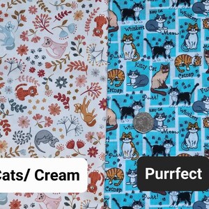 May include: Two fabric swatches with a cat theme. The left swatch is cream with a floral pattern and small cats. The right swatch is turquoise blue with a repeating pattern of cats in various poses and the text "Purrfect".