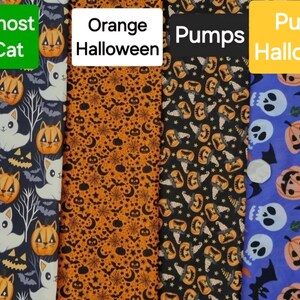 May include: Four different fabric swatches with Halloween themes. The first swatch is a dark blue fabric with a white cat and orange pumpkins. The second swatch is an orange fabric with black stars, moons, and bats. The third swatch is a black fabric with orange pumpkins and black witch hats. The fourth swatch is a purple fabric with orange pumpkins, white skulls, and black bats.