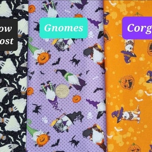 May include: Three fabric swatches featuring Halloween themes. The first swatch is black with white ghosts and bats. The second swatch is purple with white polka dots and gnomes dressed in Halloween costumes. The third swatch is orange with brown spots and corgis dressed in Halloween costumes. The text on the swatches reads "Glow Ghost", "Gnomes", and "Corgi".