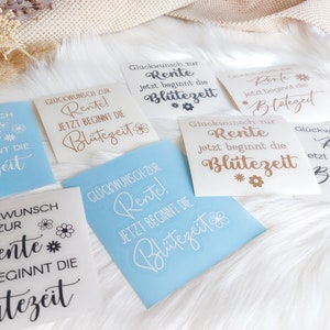 May include: Six different versions of a retirement announcement sign. The signs are all white with black, brown, or gold lettering. The text on the signs reads "Gl&uuml;ckwunsch zur Rente! Jetzt beginnt die Bl&uuml;tezeit" which translates to "Congratulations on your retirement! Now the bloom time begins".