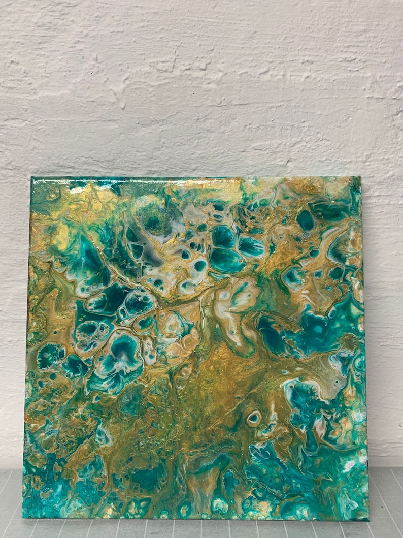 12x12\u201d green white and gold shimmery acrylic pour on canvas with lots of cells