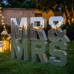 May include: A set of three ceramic mugs with a speckled, matte finish. The mugs are in shades of cream, light brown, and dark brown. Each mug has a simple, minimalist design, perfect for coffee or tea.