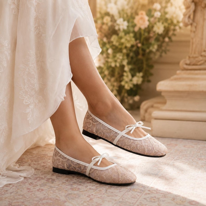 Delicate lace bridal flats with transparent floral mesh and strap styles, minimalist wedding ballet shoes in ivory tones, soft comfortable footwear for bride displayed on neutral fabric background, multiple elegant variations