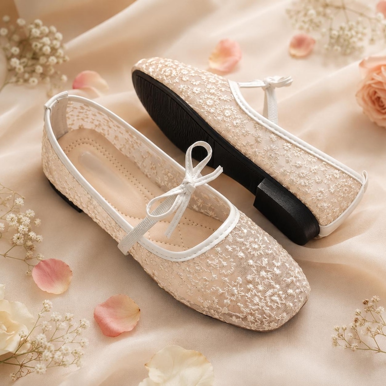 Delicate lace bridal flats with transparent floral mesh and strap styles, minimalist wedding ballet shoes in ivory tones, soft comfortable footwear for bride displayed on neutral fabric background, multiple elegant variations