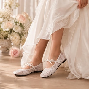 Delicate lace bridal flats with transparent floral mesh and strap styles, minimalist wedding ballet shoes in ivory tones, soft comfortable footwear for bride displayed on neutral fabric background, multiple elegant variations