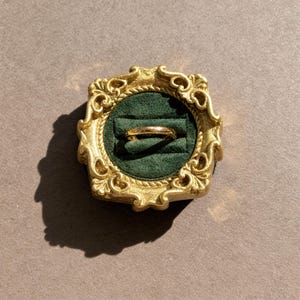 Velvet ring holder with vintage gold frame, engagement ring display. Ring box in multiple colors for wedding and jewelry photography