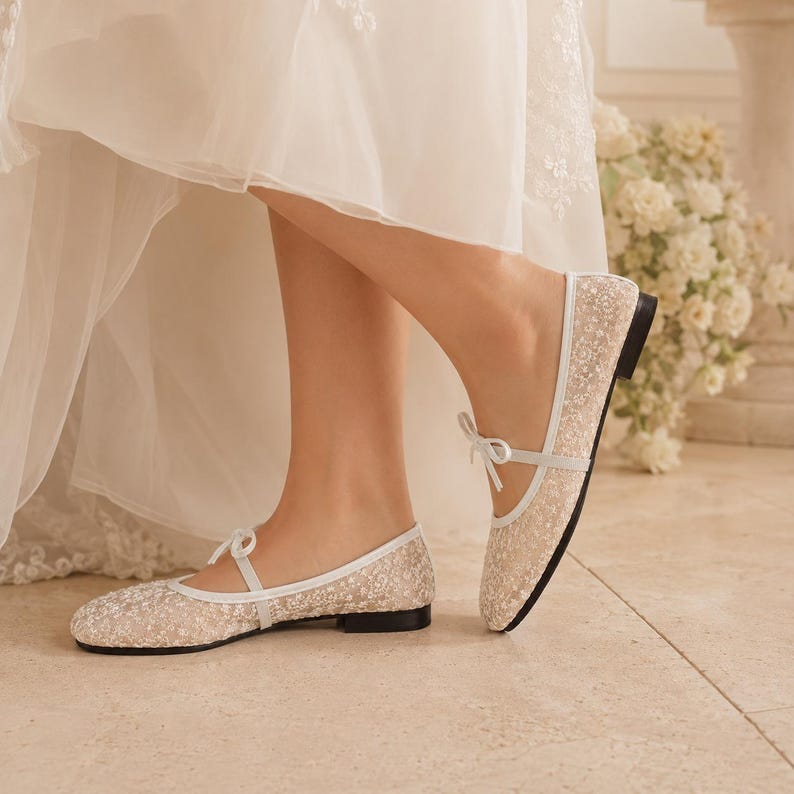 Delicate lace bridal flats with transparent floral mesh and strap styles, minimalist wedding ballet shoes in ivory tones, soft comfortable footwear for bride displayed on neutral fabric background, multiple elegant variations