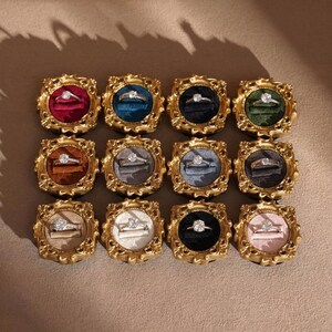 Velvet ring holder with vintage gold frame, engagement ring display. Ring box in multiple colors for wedding and jewelry photography