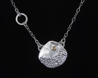 Fine and sterling silver and 14k gold "Moonscape" pendant