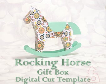 May include: A digital cut template for a rocking horse gift box. The horse is decorated with a colorful mandala pattern and the base is a light green color. The template includes instructions for assembly.