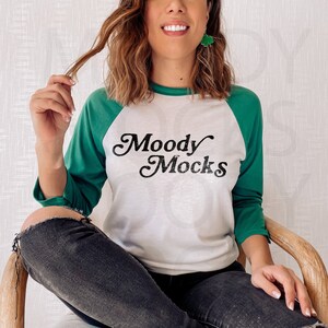 St Patricks Day Mockup | Bella Canvas 3200 Mockup | Bella Canvas Kelly & White 3/4 Sleeve Baseball Shirt Mockup | Model Mockup | Moody Mocks