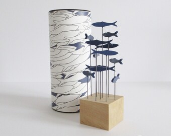 Blue shoal of fish in a decorative tube, herring design, small sculpture for windowsill, desk, bookshelf, great gift