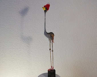 Paper mache figure bird with red hat, bird figure with yellow beak