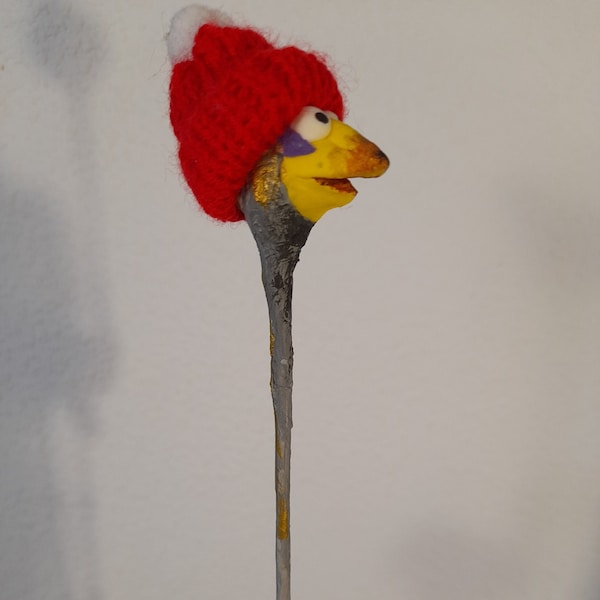 Paper mache figure bird with feather in the head, bird figure with yellow beak