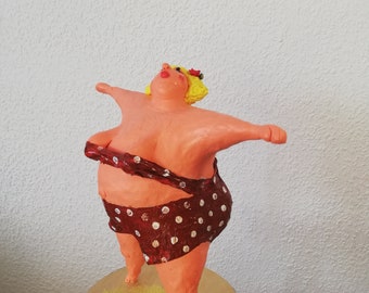 Paper mache figure of a confident woman, swimmer Paper mache figure