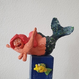 Figure mermaid in old age, funny figure fat mermaid