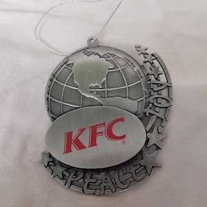 KFC Weihnachtskugel aus silbernem Metall, ausgezeichneter Globus mit Frieden, Freude und Sternen