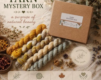 May include: A brown cardboard box labeled YARN MYSTERY BOX with five twisted skeins of yarn in shades of mustard yellow, cream, and sage green. The box features a sticker with the text Eco Yarn and the phrase a surprise of natural beauty.