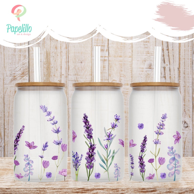 May include: Three clear glass tumblers with bamboo lids and clear straws. Each tumbler features a watercolor design of lavender flowers and greenery on a white background.