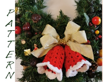 May include: A red and white crocheted Christmas bell ornament with a gold bow on a green wreath.