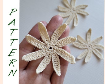 May include: Three crocheted cream-colored flower shapes with eight points each. The flowers are about 2 inches in diameter.