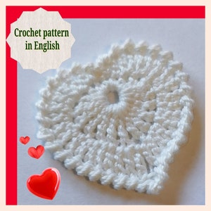 May include: White crochet heart with a hole in the center. Crochet pattern in English.