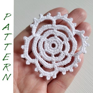May include: White crocheted doily with a circular design and multiple layers.