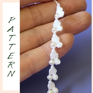 May include: White crocheted trim with small white beads. The trim is made of delicate crocheted flowers.