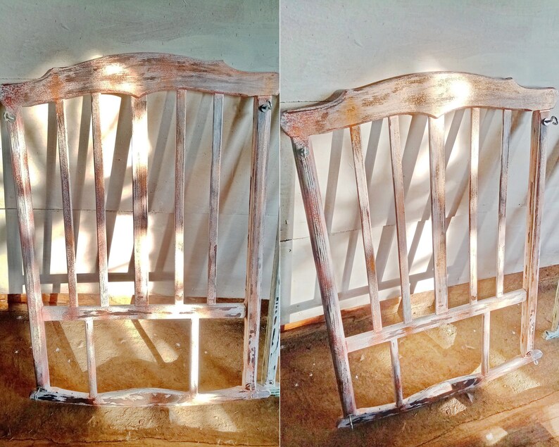 May include: A whitewashed wooden headboard with a slatted design. The headboard is distressed and has a rustic look.
