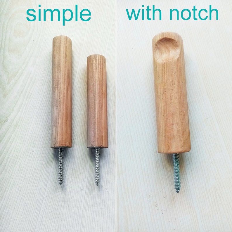 May include: Two wooden dowel rods with screws. The rod on the left is plain. The rod on the right has a notch carved into the top.