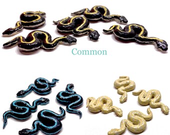 A miniature garter snake polymer clay (Common, Puget sound, Albino)