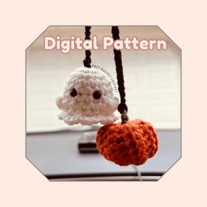 May include: Digital pattern for crocheting a ghost and a pumpkin. The ghost is white with black eyes and a white hat. The pumpkin is orange. The pattern is called "Rust Bucket Crochet".