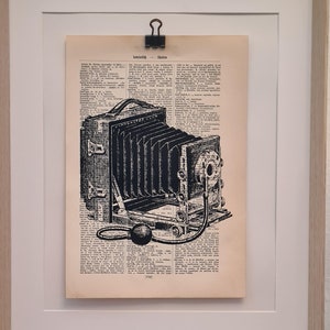 Art print of an old camera, on an antique book page, box camera, photo, photograph, camera obscura, darkroom, picture, vintage