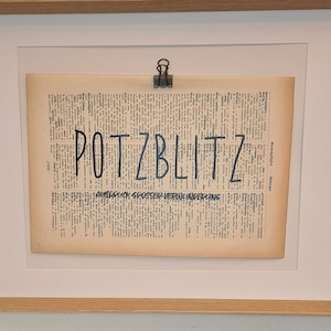 Art print of the beautiful word Potzblitz on an antique book page, language, words, forgotten, huh, great surprise, vintage, sustainable
