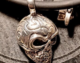 Engraved skull pendant