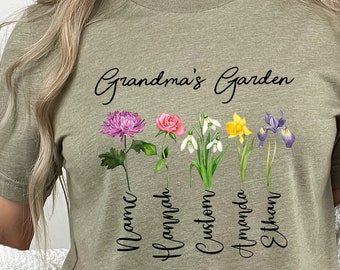 May include: A green t-shirt with the text "Grandma's Garden" and a row of five flowers with names underneath: "Name", "Hannah", "Custom", "Amanda", and "Ethan".