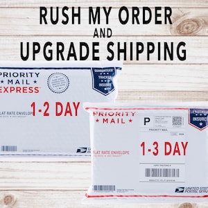 May include: Two white Priority Mail envelopes with the text "1-2 Day" and "1-3 Day" printed on them. The envelopes are both flat rate and have a "Guaranteed Tracker Insured" label.