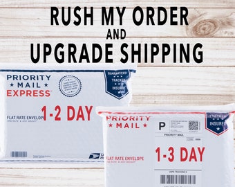 May include: Two white Priority Mail envelopes with the text "1-2 Day" and "1-3 Day" printed on them. The envelopes are both flat rate and have a "Guaranteed Tracker Insured" label.