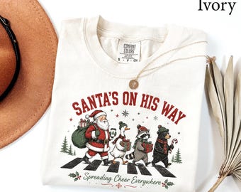 Comfort Colors® Santas On His Way Shirt, Funny Santa Christmas Shirt, Christmas Gift, Family Christmas Tee, Christmas Goose Raccoon Shirt