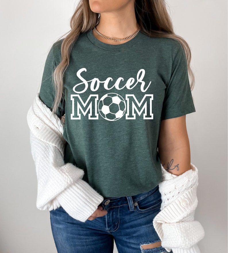 May include: A green t-shirt with the text "Soccer Mom" in white with a white soccer ball graphic.
