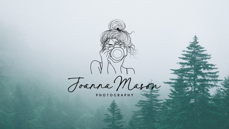 May include: A minimalist logo design for Joanna Mason Photography. The image features a line drawing of a person holding a camera, with the name "Joanna Mason" in elegant script below, and "Photography" in a simple font. The background is a misty forest scene.