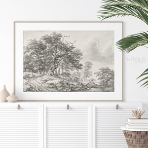 May include: A black and white pencil drawing of a woodland scene with a path leading through the trees. The drawing is framed and hanging on a white wall.